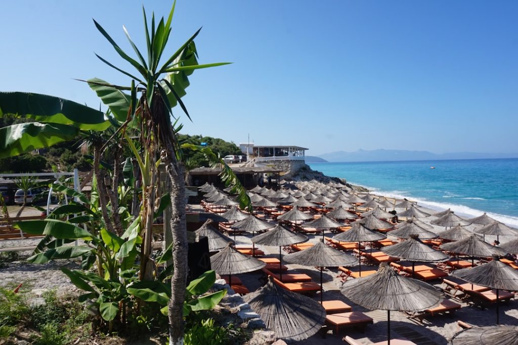 A bunch of umbrellas that are on a beach