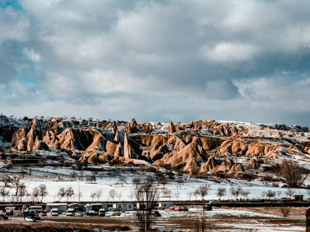 Snow-covered rock formations under a cloudy sky