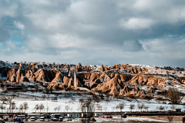 Snow-covered rock formations under a cloudy sky